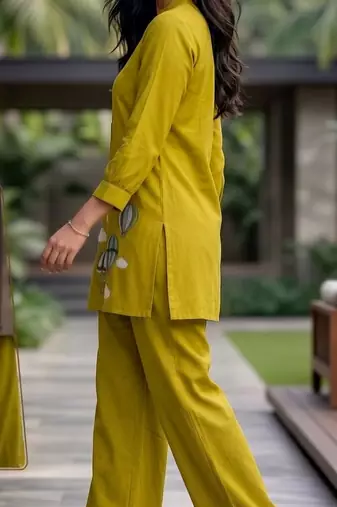 Trendy solid olive green cotton kurta with hot air balloon embroidery and matching trousers
