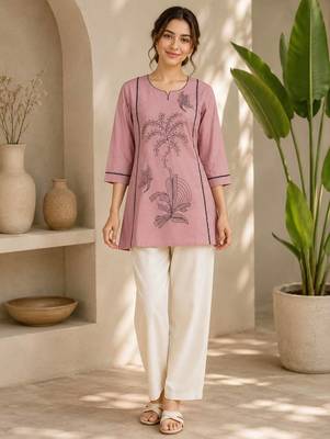  light pink cotton kurta with black botanical embroidery and white trousers 1