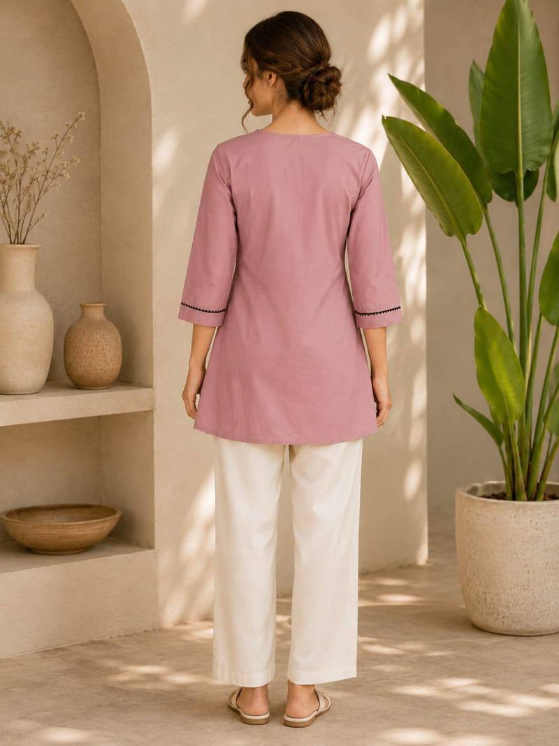New elegant light pink cotton kurta with black botanical embroidery and white trousers