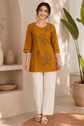 New elegant mustard  cotton kurta with black botanical embroidery and white trousers