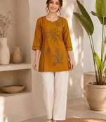 New elegant mustard  cotton kurta with black botanical embroidery and white trousers