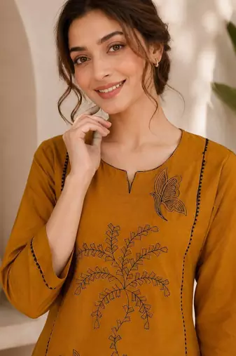 New elegant mustard  cotton kurta with black botanical embroidery and white trousers