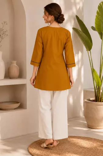 New elegant mustard  cotton kurta with black botanical embroidery and white trousers