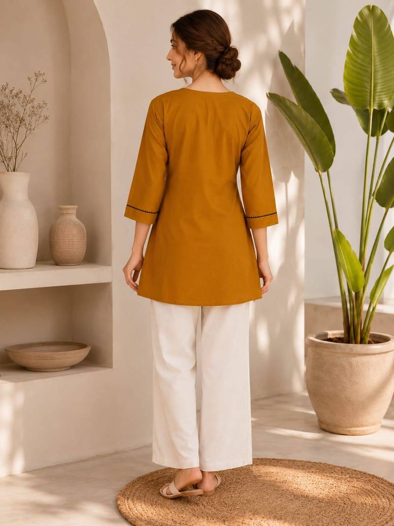 New elegant mustard  cotton kurta with black botanical embroidery and white trousers