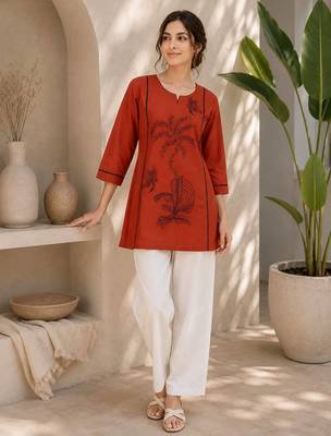  rust cotton kurta with black botanical embroidery and white trousers 1