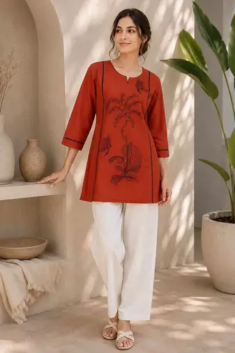 New elegant rust cotton kurta with black botanical embroidery and white trousers
