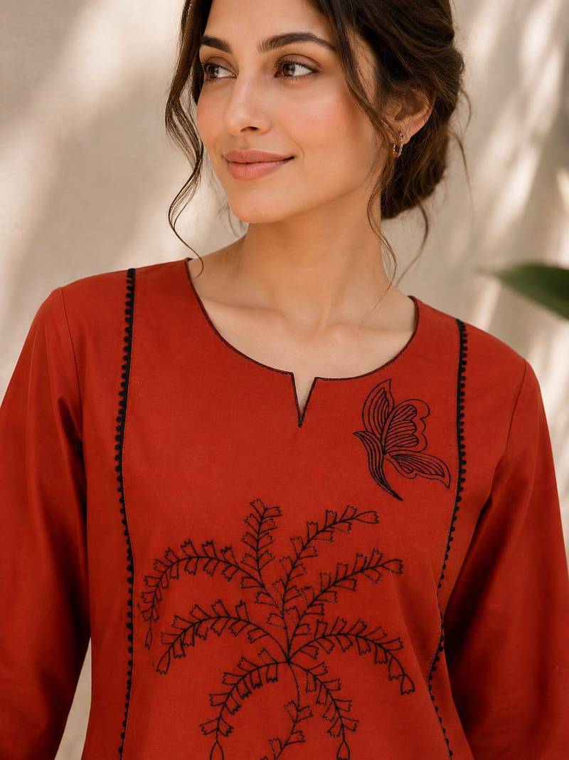 New elegant rust cotton kurta with black botanical embroidery and white trousers