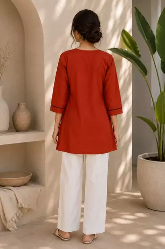 New elegant rust cotton kurta with black botanical embroidery and white trousers