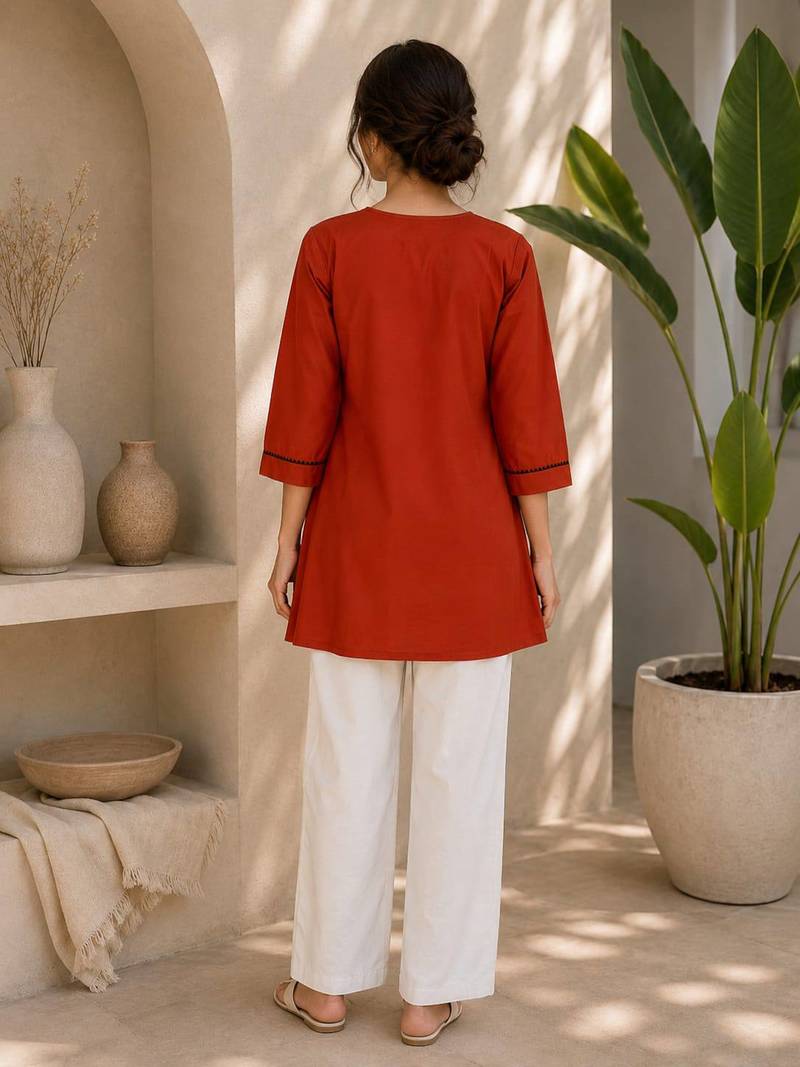 New elegant rust cotton kurta with black botanical embroidery and white trousers