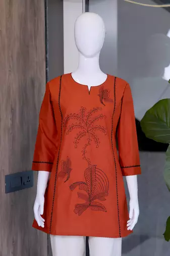 New elegant rust cotton kurta with black botanical embroidery and white trousers