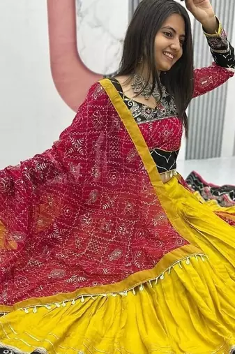 NAVRATRI WEAR YELLOW RAYON THREAD SEQUINCE EMBROIDERED LEHENGA CHOLI DUPATTA FREE SIZE FULL-STITCHED.