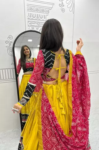 NAVRATRI WEAR YELLOW RAYON THREAD SEQUINCE EMBROIDERED LEHENGA CHOLI DUPATTA FREE SIZE FULL-STITCHED.