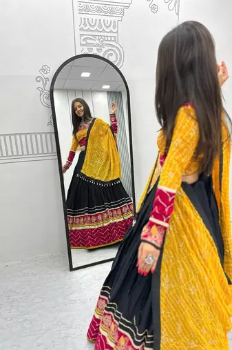 NAVRATRI WEAR YELLOW RAYON THREAD SEQUINCE EMBROIDERED LEHENGA CHOLI DUPATTA FREE SIZE FULL-STITCHED.