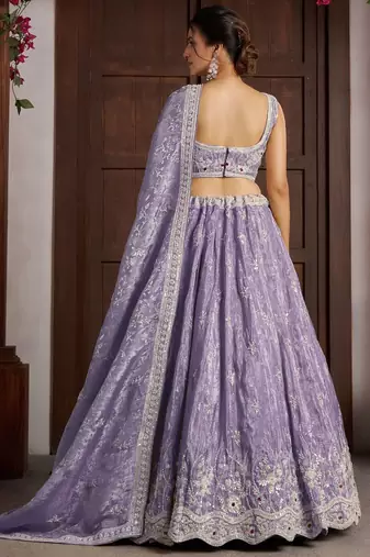 Luxurious Purple Banarasi Tissue Lehenga Adorned with Bead Embellishments