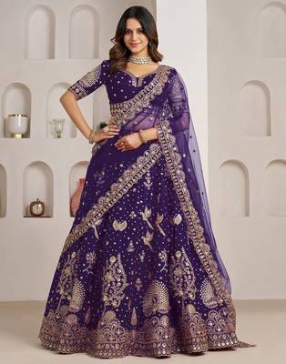 Luxurious Purple Lehenga Featuring Intricate Floral and Bird Designs 1