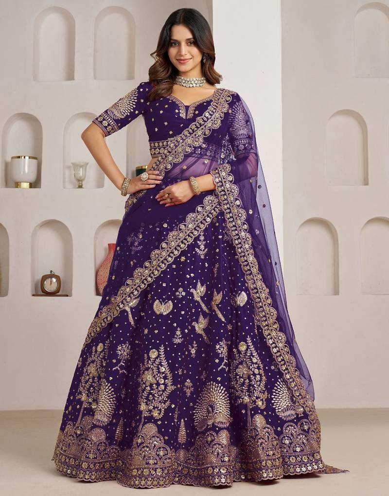 Luxurious Purple Lehenga Featuring Intricate Floral and Bird Designs