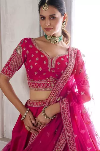 Luxurious Purple Lehenga Featuring Intricate Floral and Bird Designs