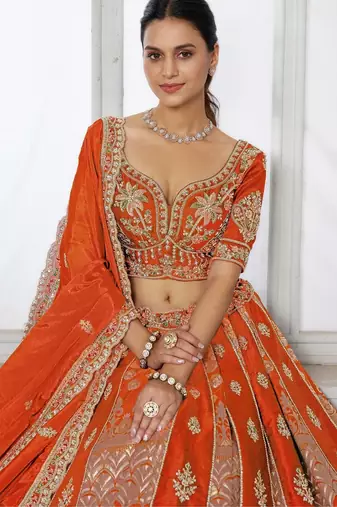 Elegant Rust Lehenga Featuring Rich Raw Silk and Artisan Craftsmanship