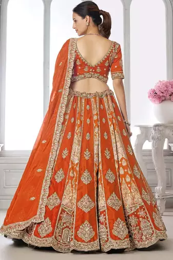 Elegant Rust Lehenga Featuring Rich Raw Silk and Artisan Craftsmanship