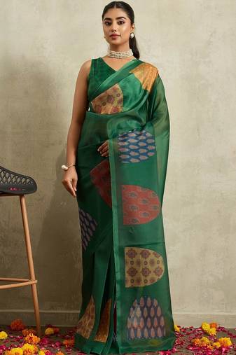 Green printed tissue festive wear saree with blouse piece
