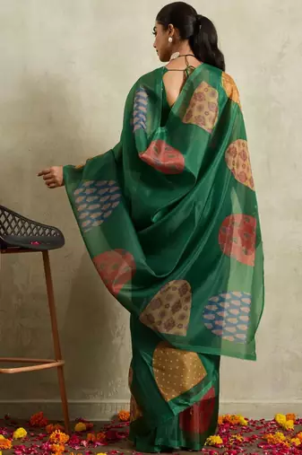 Green printed tissue festive wear saree with blouse piece