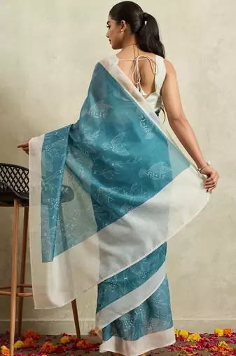 Teal printed blended cotton designer saree with blouse piece