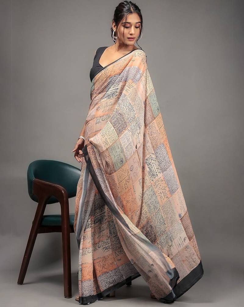 Orange elegant printed georgette saree with blouse piece