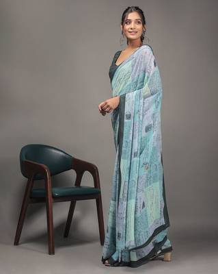 Green elegant printed georgette saree with blouse piece 1