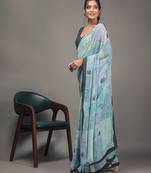 Green elegant printed georgette saree with blouse piece