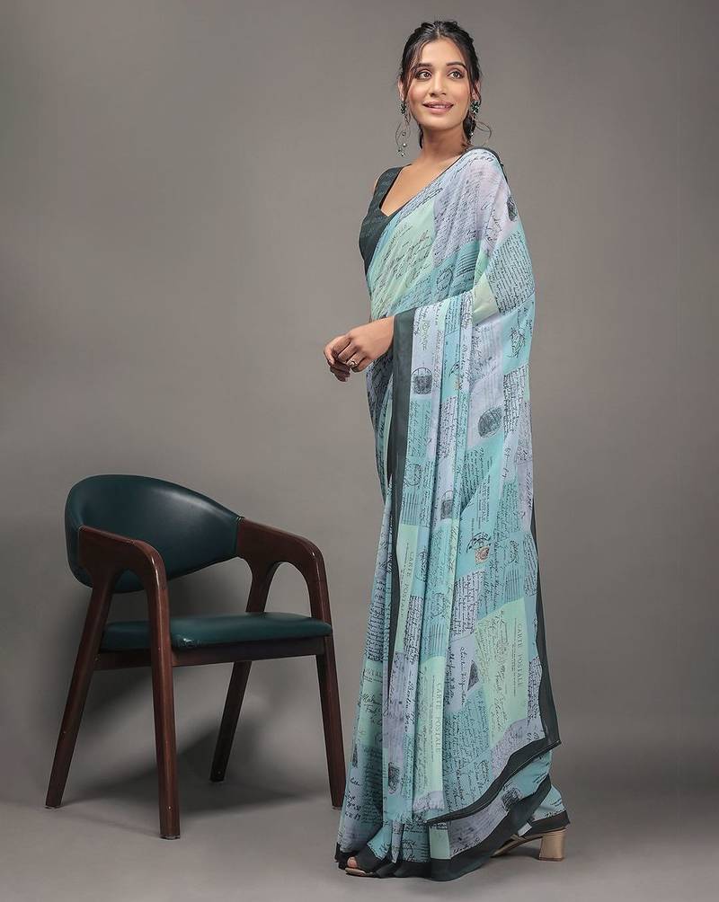 Green elegant printed georgette saree with blouse piece