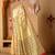 Cream printed art silk traditional saree with blouse piece