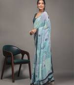 Green elegant printed georgette saree with blouse piece