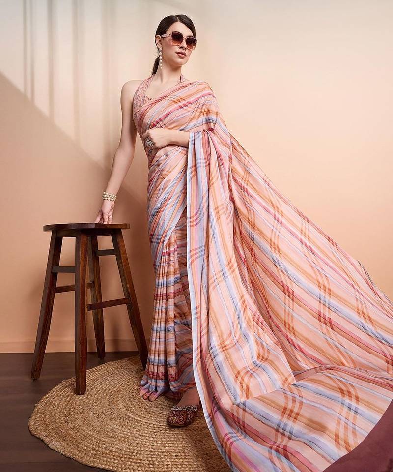 Peach elegant printed georgette saree with blouse piece