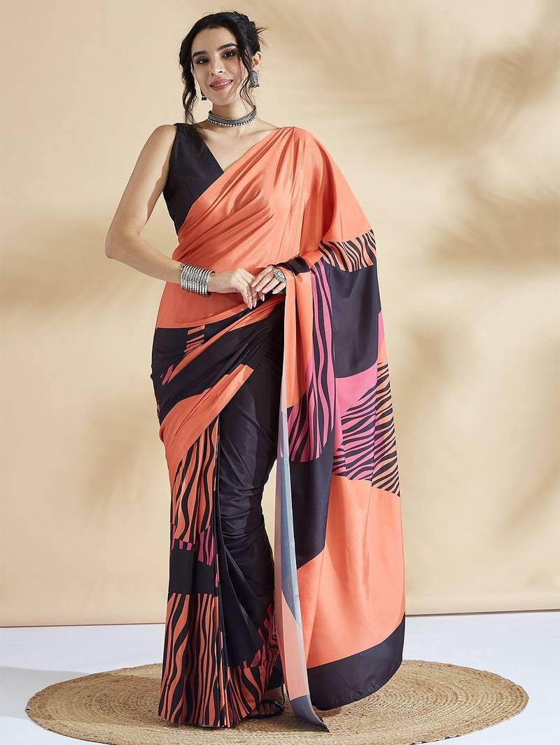Orange printed crepe casual saree with blouse piece