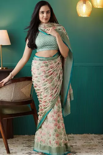 Cream printed brasso casual saree with blouse piece