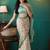 Cream printed brasso casual saree with blouse piece