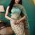 Cream printed brasso casual saree with blouse piece