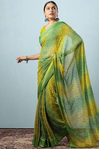 Green elegant printed georgette saree with blouse piece
