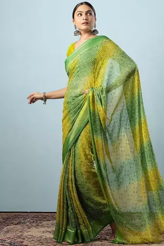 Green elegant printed georgette saree with blouse piece