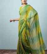 Green elegant printed georgette saree with blouse piece