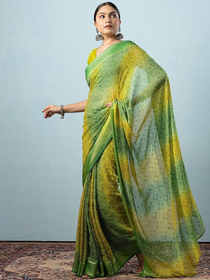 Green elegant printed georgette saree with blouse piece