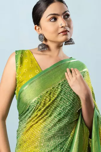 Green elegant printed georgette saree with blouse piece