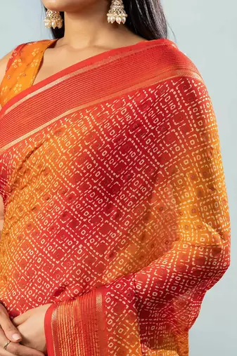 Red elegant printed georgette saree with blouse piece
