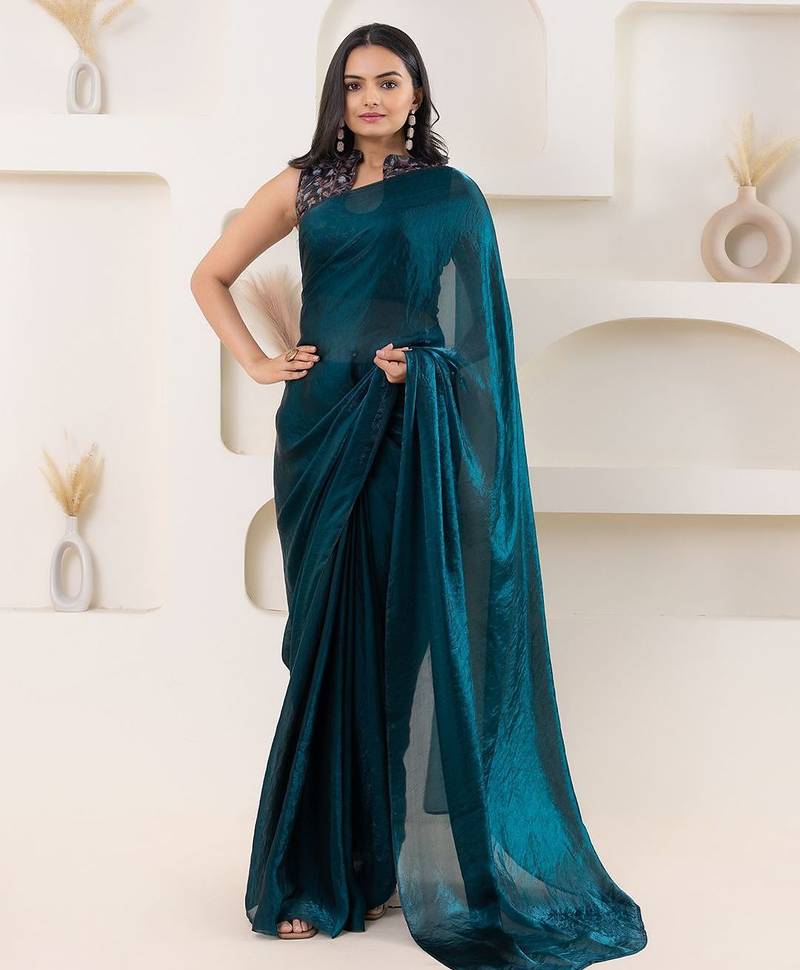 Teal plain tissue festive wear saree with blouse piece
