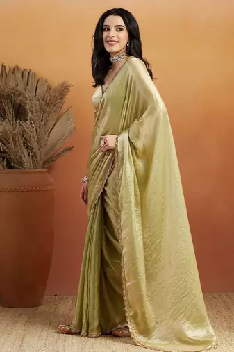 Green plain tissue festive wear saree with blouse piece