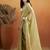 Green plain tissue festive wear saree with blouse piece