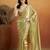 Green plain tissue festive wear saree with blouse piece