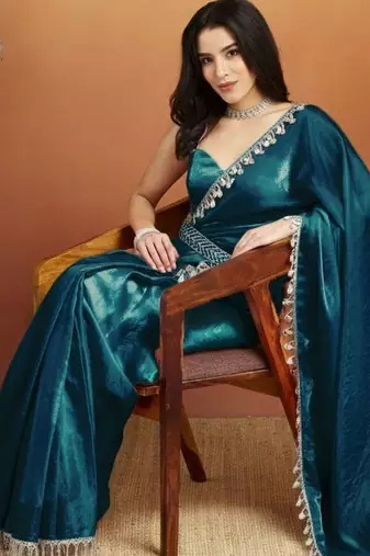 Teal plain tissue festive wear saree with blouse piece