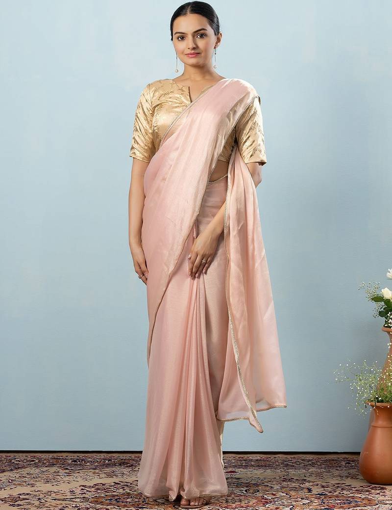 Peach plain tissue festive wear saree with blouse piece