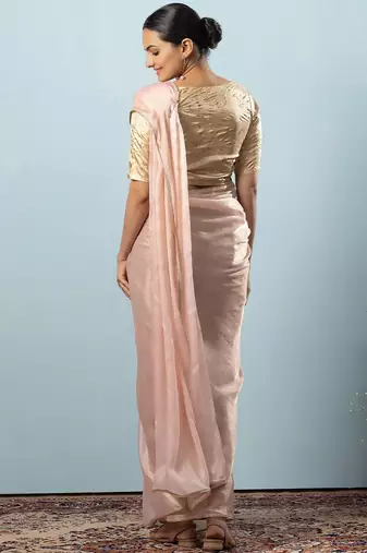 Peach plain tissue festive wear saree with blouse piece